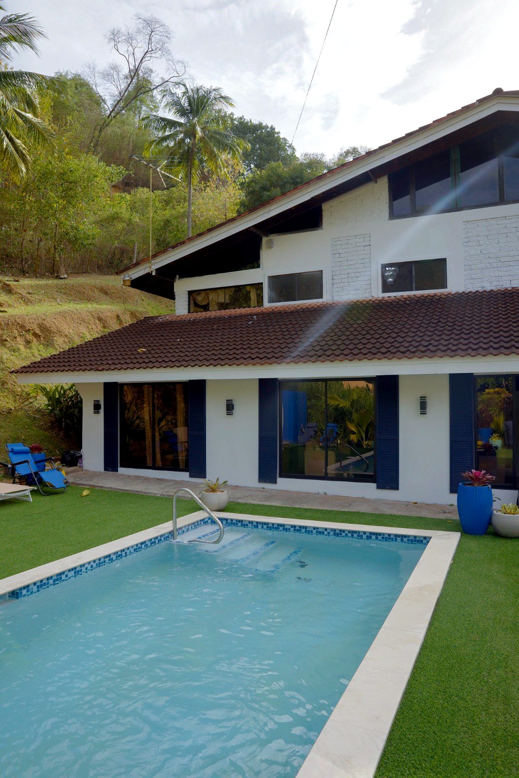The Cascade residence — a villa-style home with a private pool